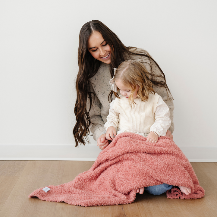 Cuddle your baby in the Saranoni BAMBONI¨ Receiving Blanket in Hibiscus, one of the best baby girl blankets for warmth and luxury.