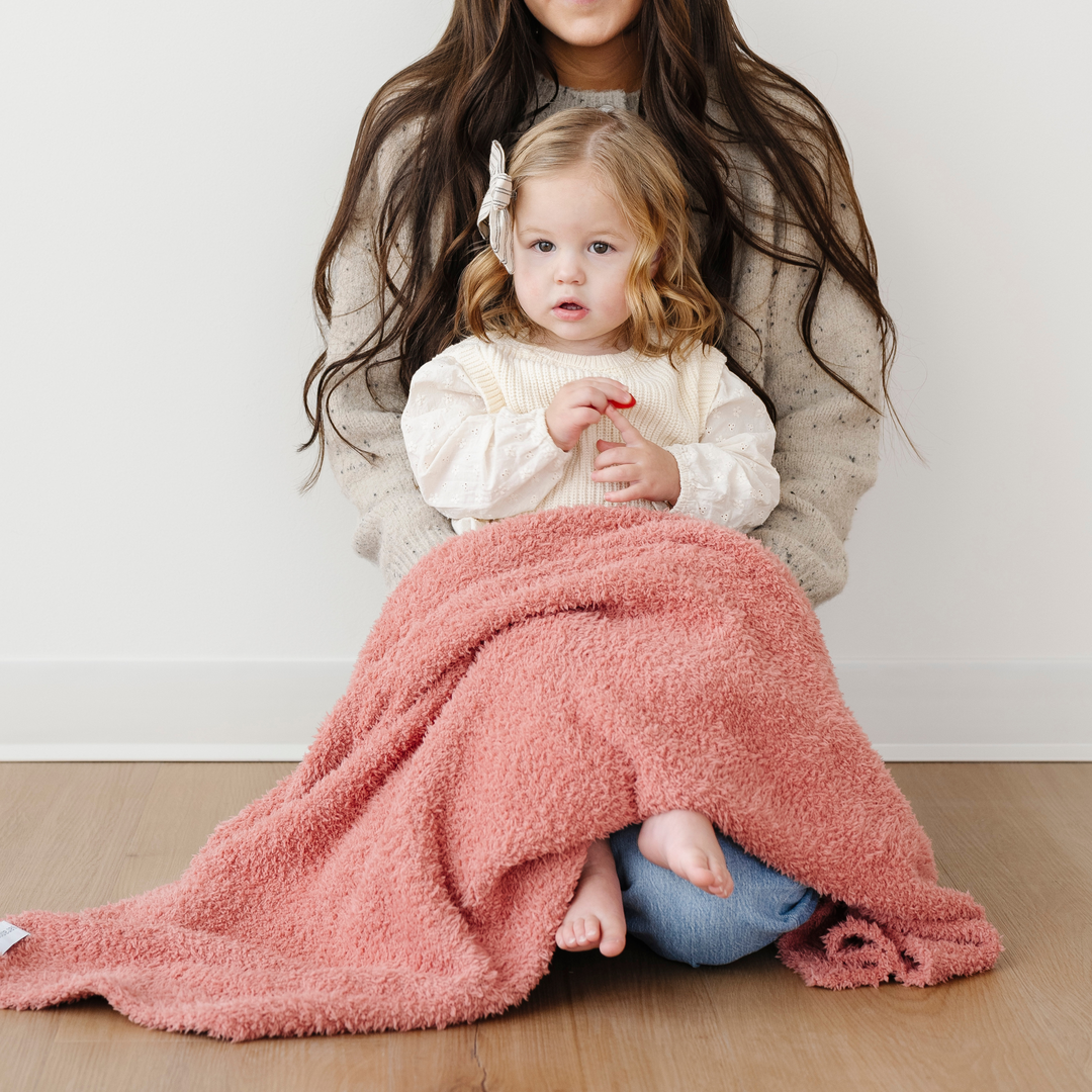Delicate and dreamy, the Saranoni Bamboni¨ Receiving Blanket in Hibiscus delivers warmth and elegance for baby girl blankets.