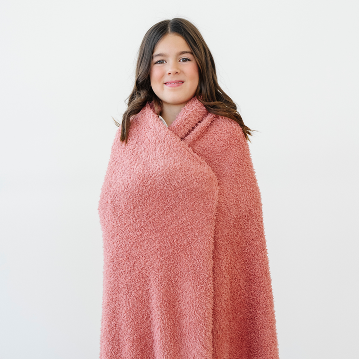 Snuggle toddlers in the Hibiscus Saranoni BAMBONI¨ Toddler Blanket, a soft toddler blanket for naps.