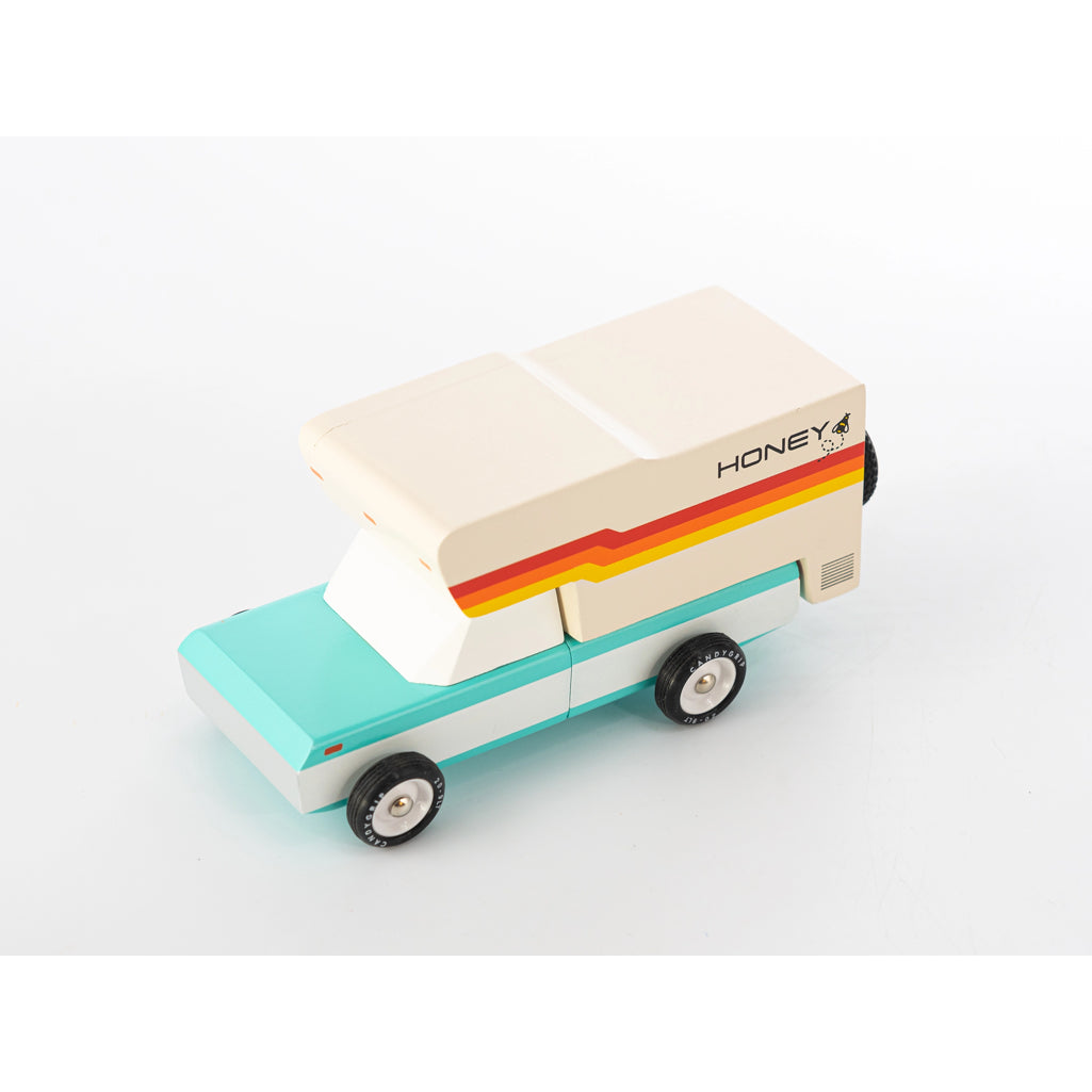 Retro wooden camper by Candylab, with a vibrant honeybee design.