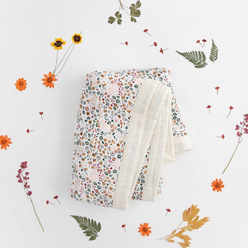 Little Unicorn Cotton Muslin Baby Quilt - Pressed Petals featuring delicate flower prints, ideal as a soft muslin blanket for nursery use.