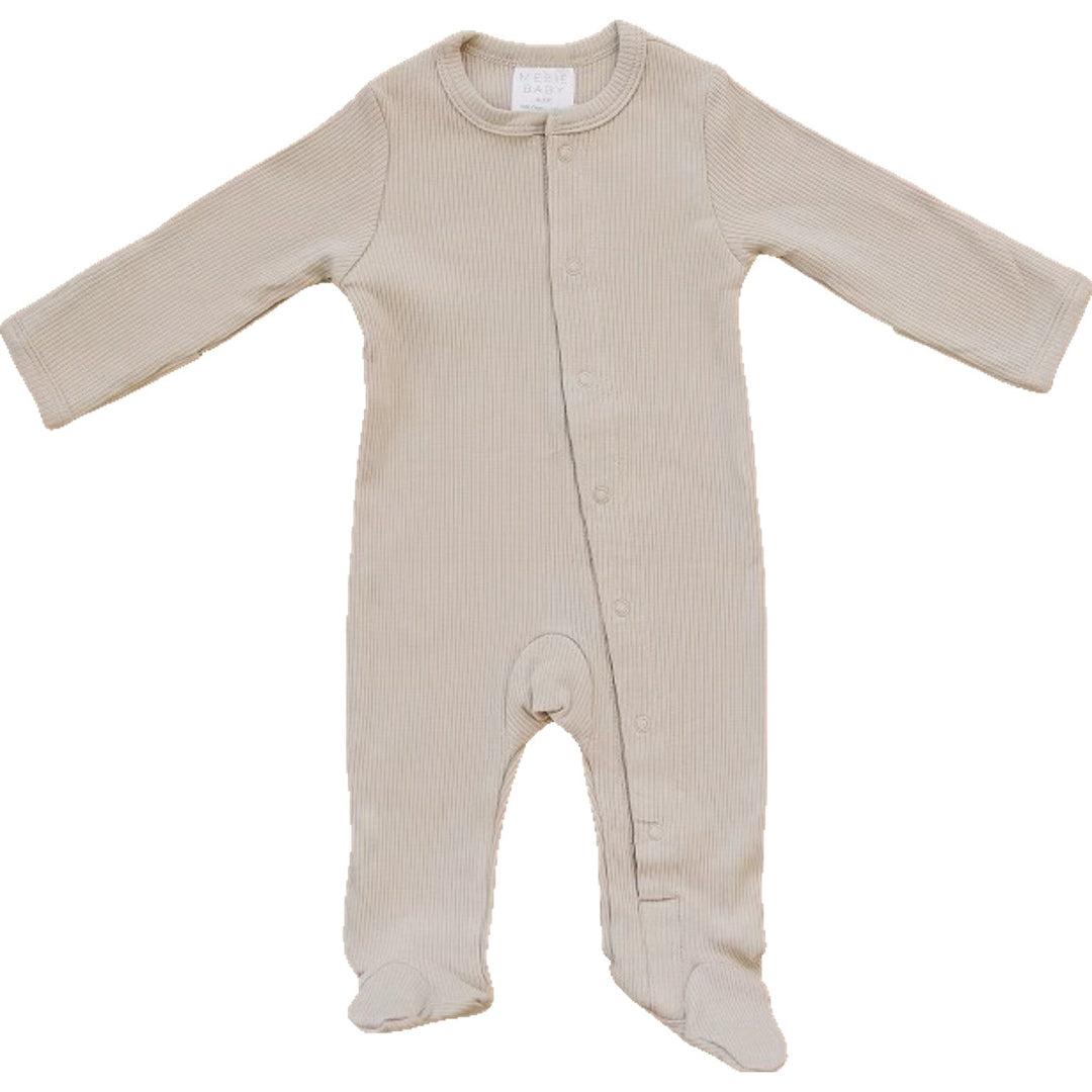 Oatmeal Organic Cotton Ribbed Snap by Mebie Baby, worn by a baby on a play mat.