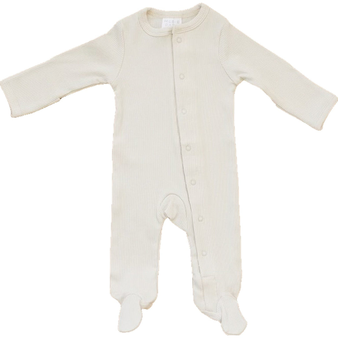 Vanilla Organic Cotton Ribbed Snap by Mebie Baby, worn by a baby on a play mat.