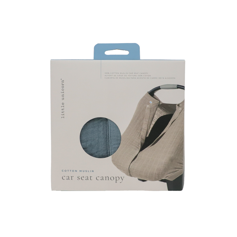 Little Unicorn Cotton Muslin Car Seat Canopy - Sea displayed on a car seat, offering cozy shade and lightweight coverage for travel.