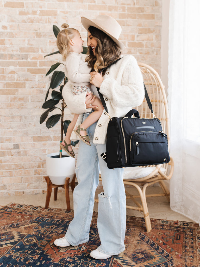 Durable metal hardware on the JuJuBe Diaper Satchel Bag in Black for long-lasting use