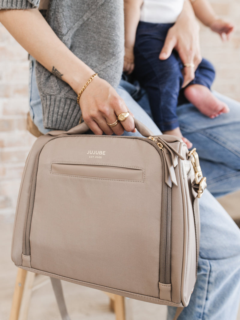 Versatile JuJuBe Insulated Bottle Bag in Taupe doubling as a lunch bag for food storage