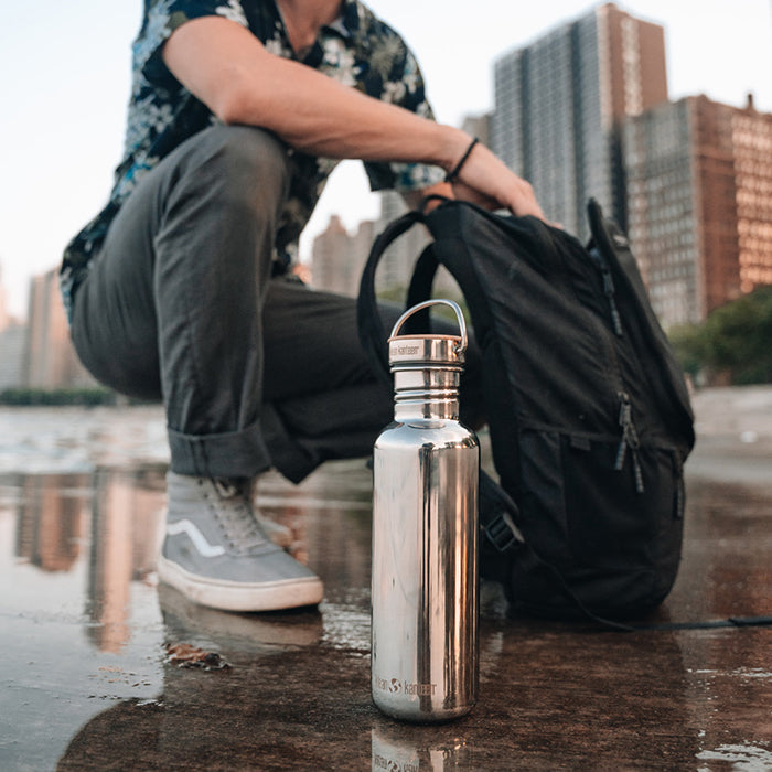 City setting featuring Klean Kanteen 27oz Reflect with Bamboo Cap in Midnight Sky, showcasing minimalist and climate controlled design