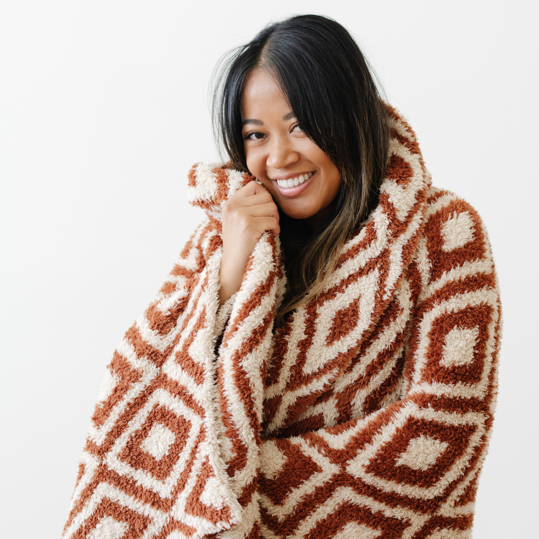 The Saranoni Double-Layer BAMONI¨ Throw Blanket in Khmer showcases artisan-inspired texture, offering a luxuriously soft baby blanket feel.