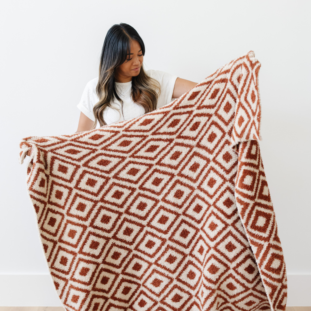 SaranoniÕs Double-Layer BAMONI¨ Throw Blanket in Khmer exudes elegance and warmth, making it a go-to toddler blanket for all seasons.