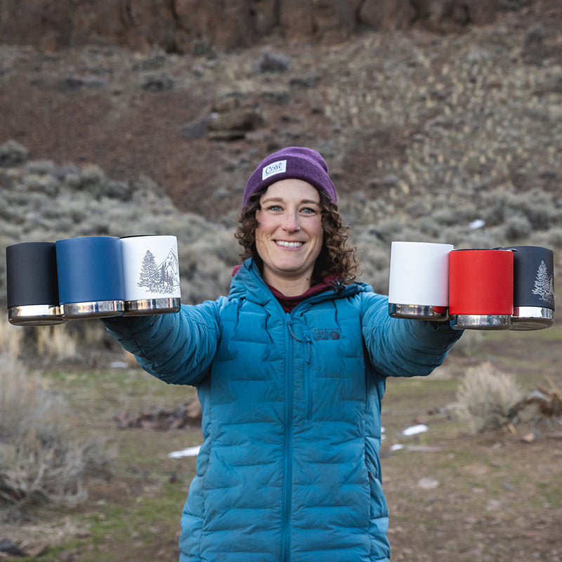 Close-up of woman holding 6 Klean Kanteen 12oz Camp Mugs, minimalist design and dishwasher safe.