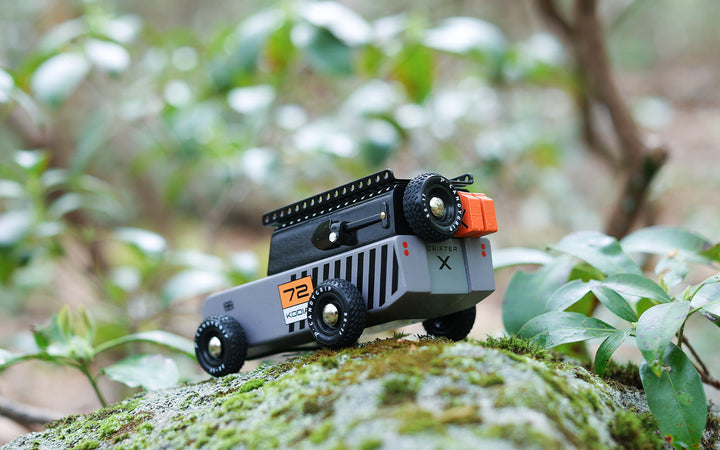 Kids explore imaginative play with the Plantoys Drifter Kodiak in this lifestyle scene, showcasing a durable car toy.