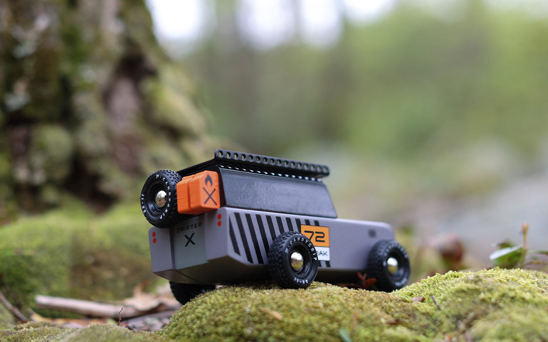 In a natural play setup, the Plantoys Drifter Kodiak becomes a favorite for parents seeking well-made toy cars for kids.
