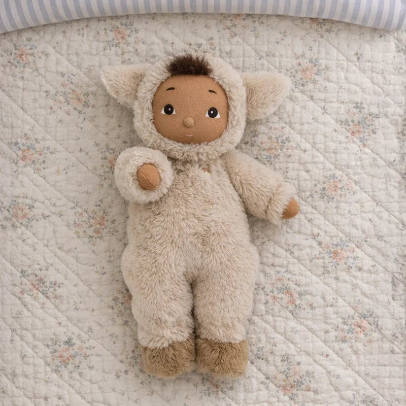 Cozy Day Dinkum Lamby Tig soft lamb doll lying on a floral quilt, Dinkum Dolls baby gift
