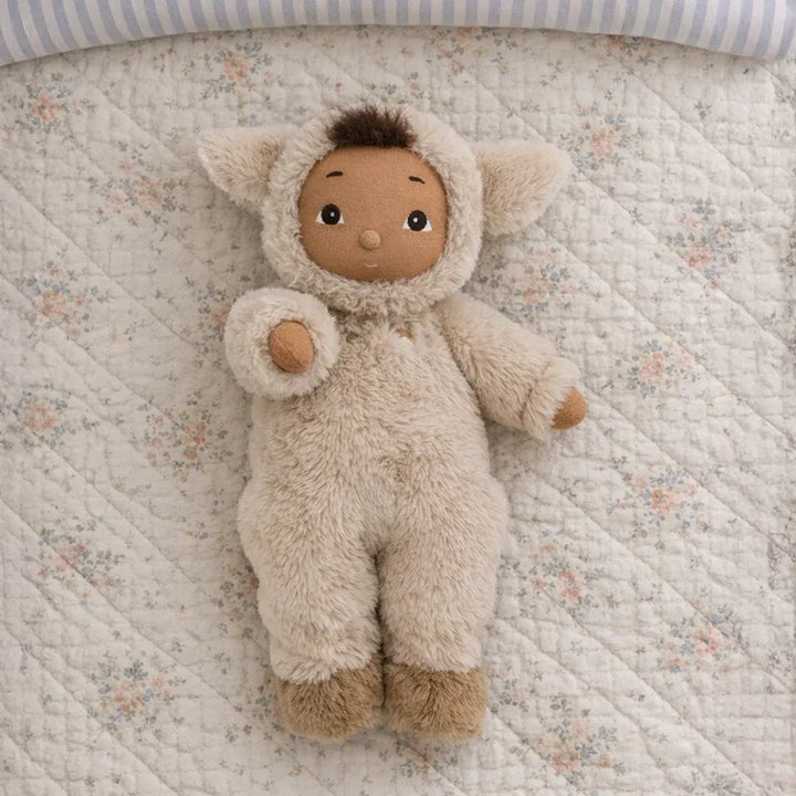 Cozy Day Dinkum Lamby Tig soft lamb doll lying on a floral quilt, Dinkum Dolls baby gift