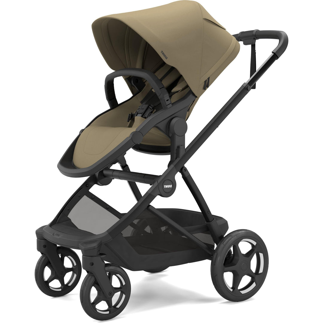 Thule Charm Stroller in Faded khaki on black, stroller seat, three-quarter view | full-size stroller from birth