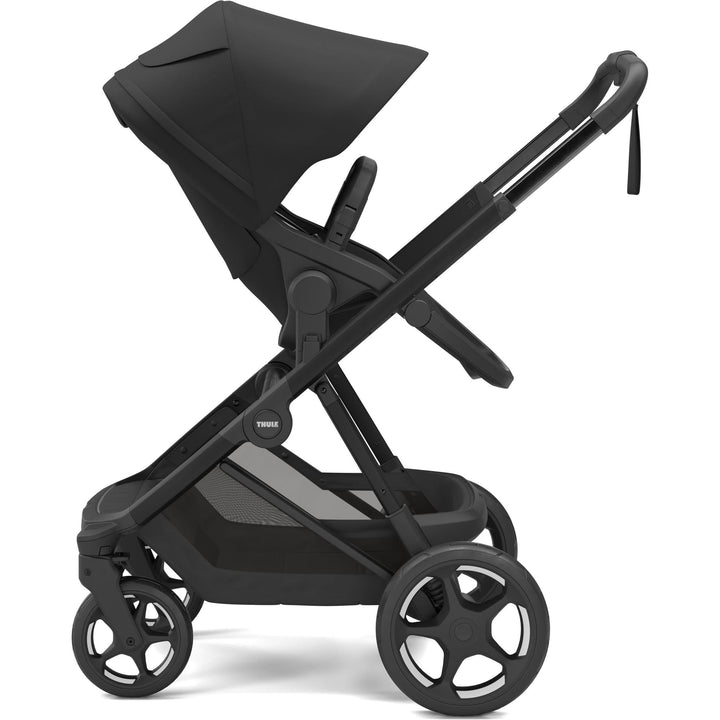 Full-size stroller from birth - Thule Charm Stroller, parent-facing seat, side view, Black on black