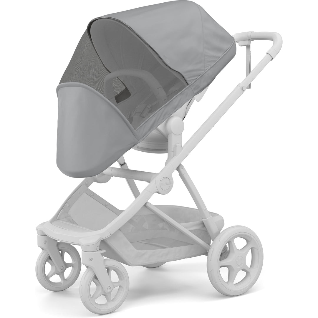 Thule Charm Stroller Mesh Cover installed on the Charm seat, three-quarter view | stroller insect net