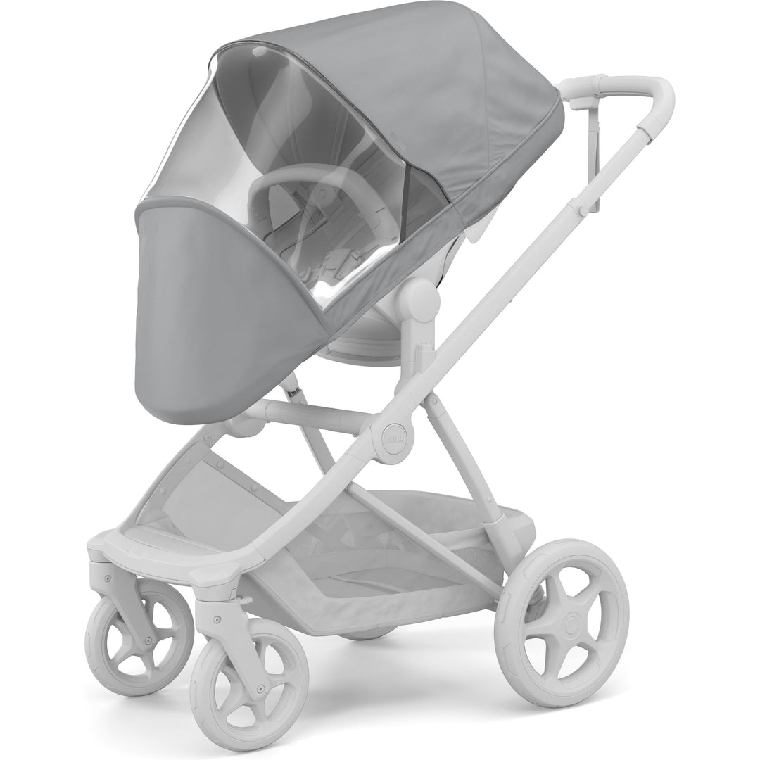 Thule Charm Stroller Rain Cover installed on the seat, three-quarter view | clear stroller rain cover