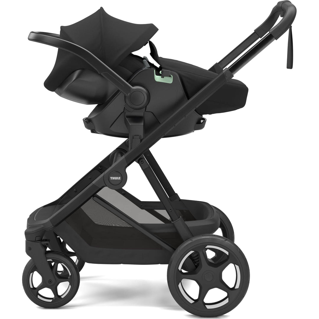 Stroller w/ newborn insert - Thule Charm Stroller, with Thule Maple car seat, side view, Black on black