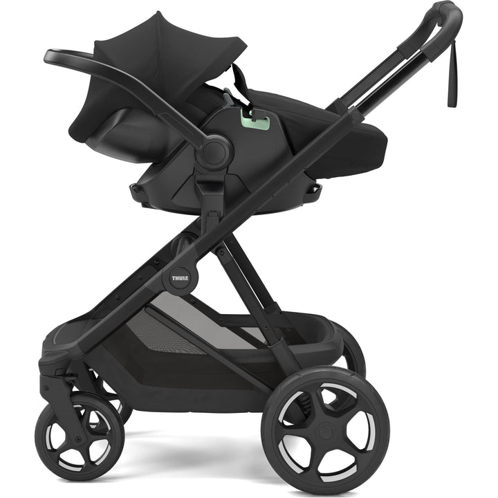 Stroller w/ newborn insert - Thule Charm Stroller, with Thule Maple car seat, side view, Black on black