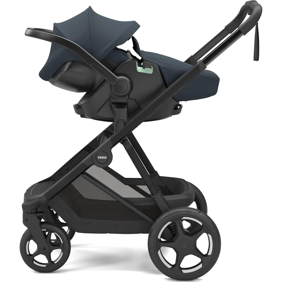 Thule Charm Stroller in Darkest blue on black, with Thule Maple car seat and boot cover | stroller w/ newborn insert