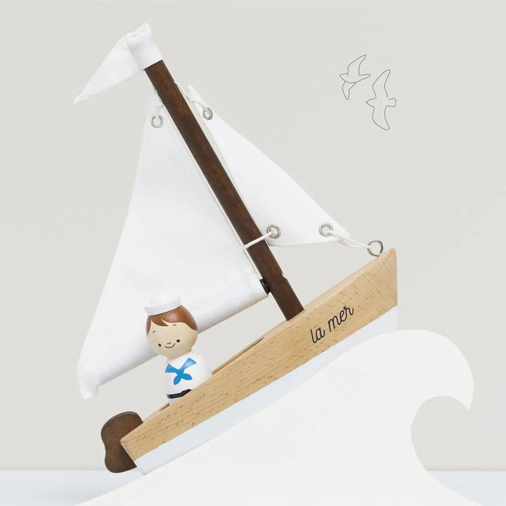 Le Toy Van's Sailing Boat with Captain wooden toy, designed for imaginative play with kids who love boats.