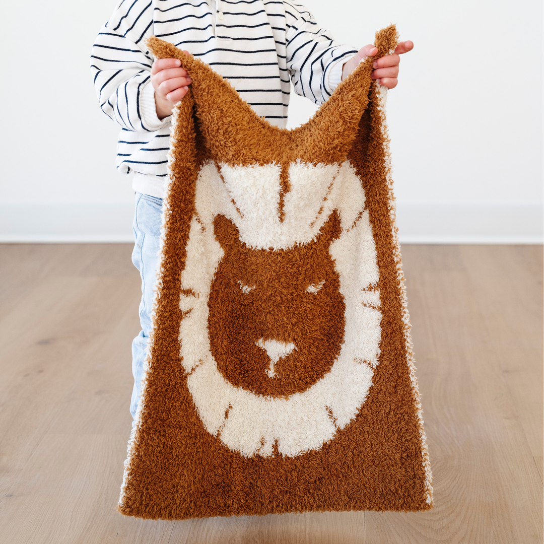 SaranoniÕs Lion Double-Layer BAMBONI¨ Mini Blanket brings cheerful charm and warmth, perfect for your baby boy blanket collection.