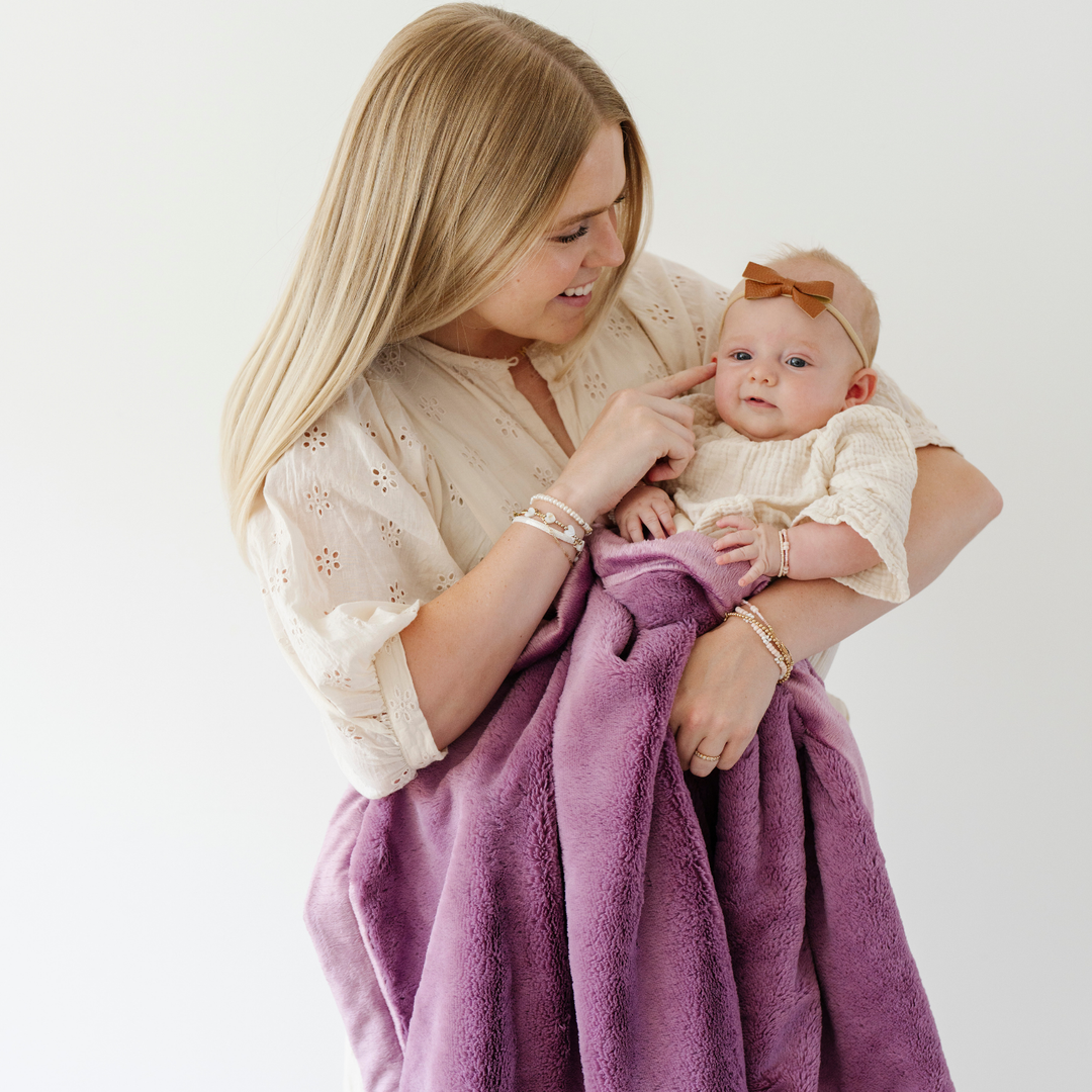 The Aubergine Saranoni Lush Receiving Blanket provides warmth and softness, ideal as baby blankets.