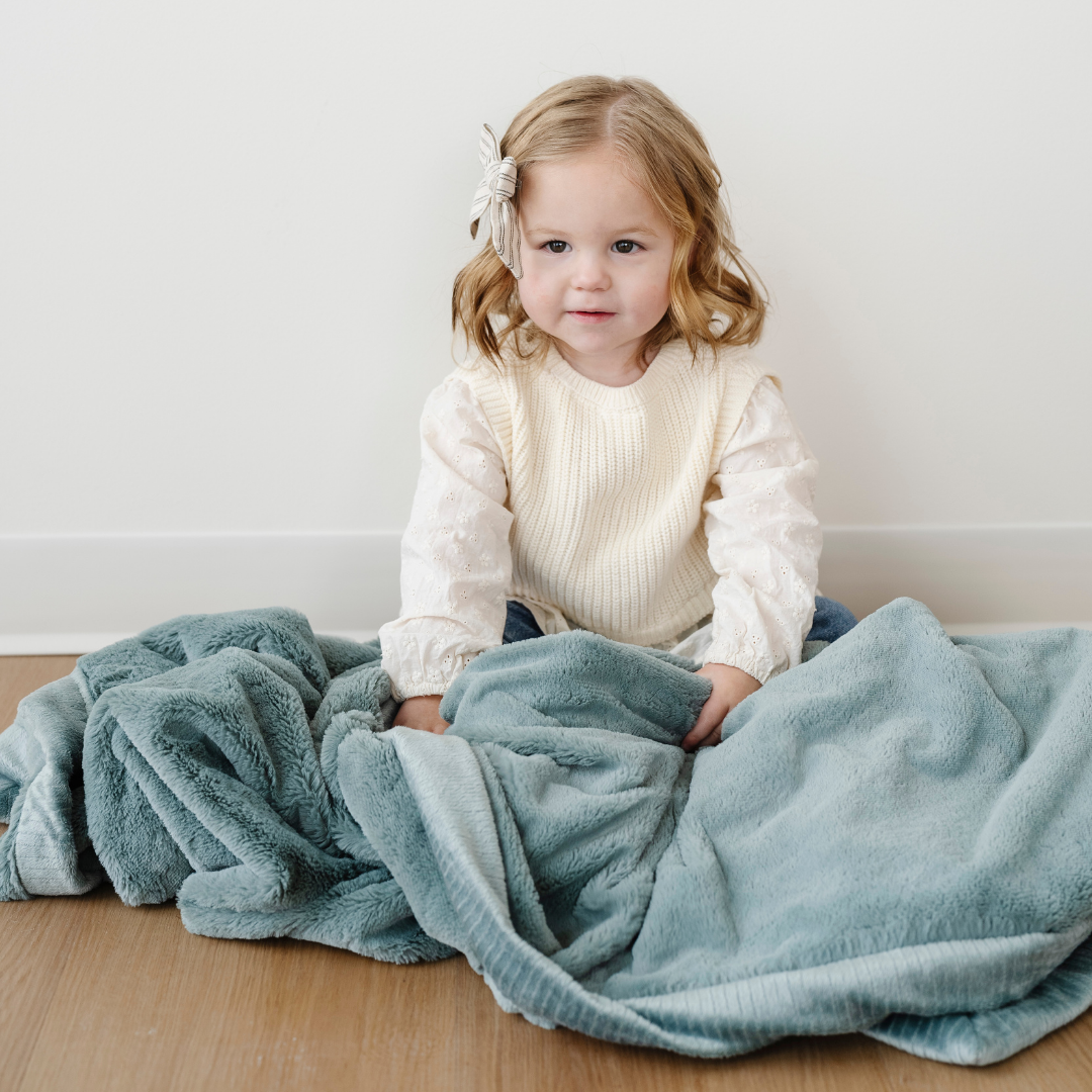 The Saranoni Lush Toddler Blanket in Eucalyptus brings plush comfort and style that works great for toddler blanket need.