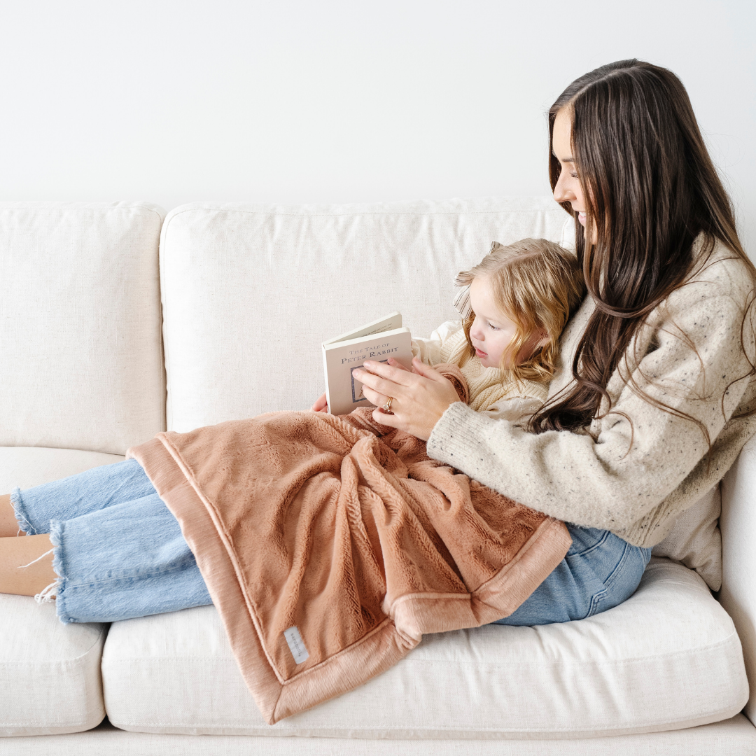 Infants stay snug with the Rosy Saranoni Lush Receiving Blanket, a soft and cozy receiving blanket.