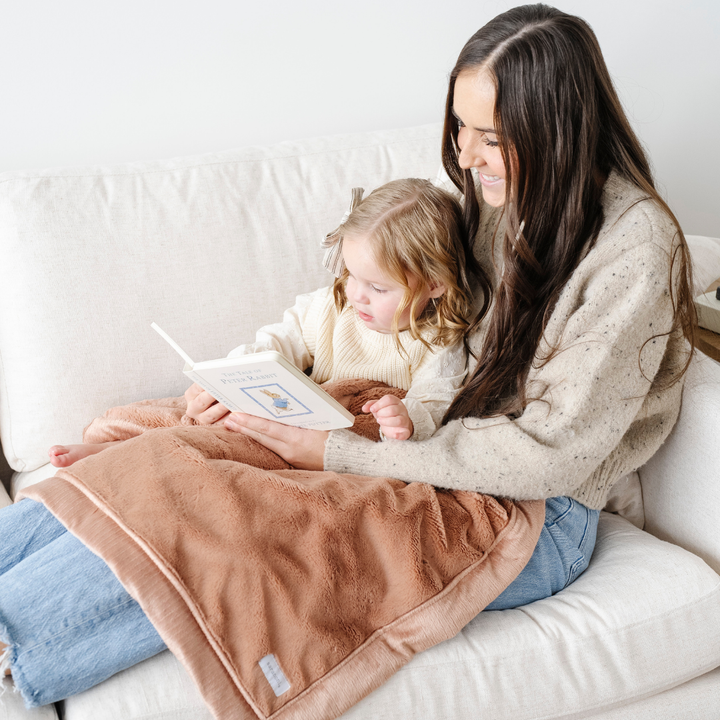 The Rosy Saranoni Lush Receiving Blanket is perfect for cuddles, a top best baby blanket.
