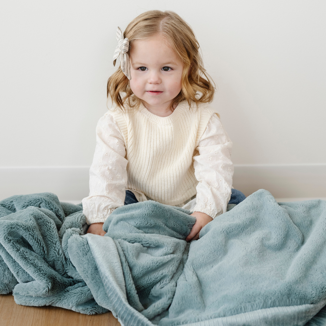 Snuggle infants in the Eucalyptus Receiving Blanket from Saranoni, soft and gentle as baby receiving blankets.