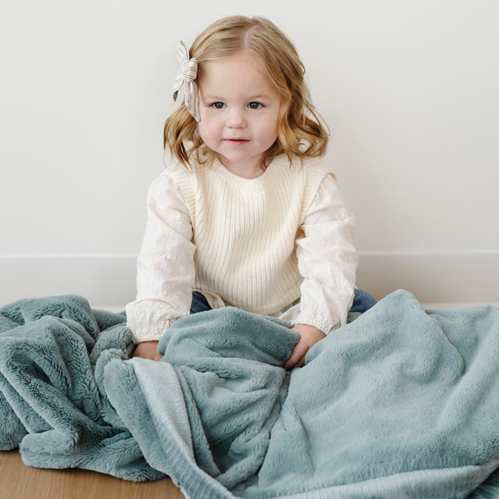 Snuggle infants in the Eucalyptus Receiving Blanket from Saranoni, soft and gentle as baby receiving blankets.