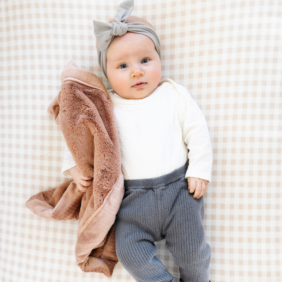 Rosy in the Saranoni Lush Mini Blanket lineup offers dreamy softness everyone looks for in soft baby blankets.