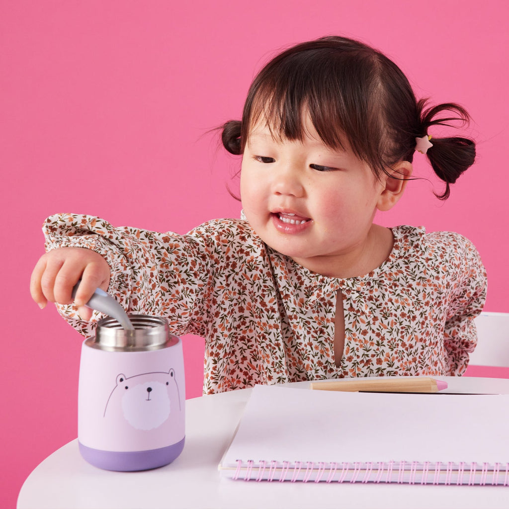 toddler eating from mini insulated food jar in bear hugs