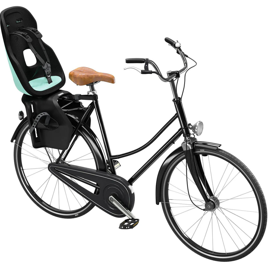 Mint Thule Yepp Nexxt2 Maxi Rack Mount in teal, a stylish and safe bike seat.