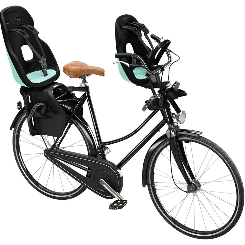 Mint and Teal Thule Yepp Nexxt2 Maxi Rack Mount, an ergonomic bike seat for kids.