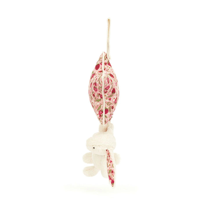 Blossom Cream Bunny Berry Musical Pull by Jellycat, close-up of strawberry patterned star