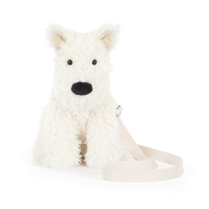 Jellycat Munro Scottie Dog Shoulder Bag worn lifestyle – model wearing black plush Scottie dog crossbody bag