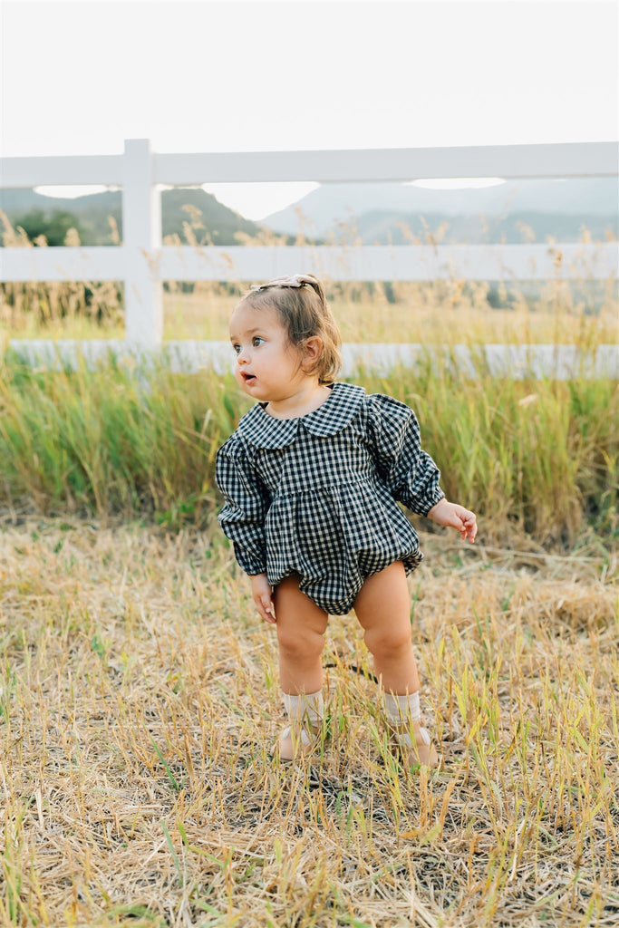 Baby wearing the Mebie Baby gingham collared romper.