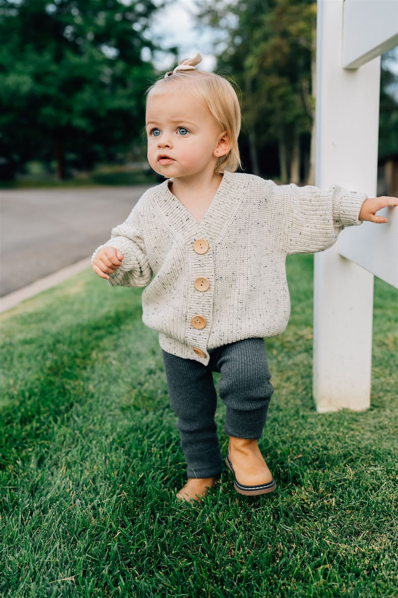 Styled in a neutral tone, the Mebie Baby Charcoal Knit Leggings easily fit the look of trendy baby clothes