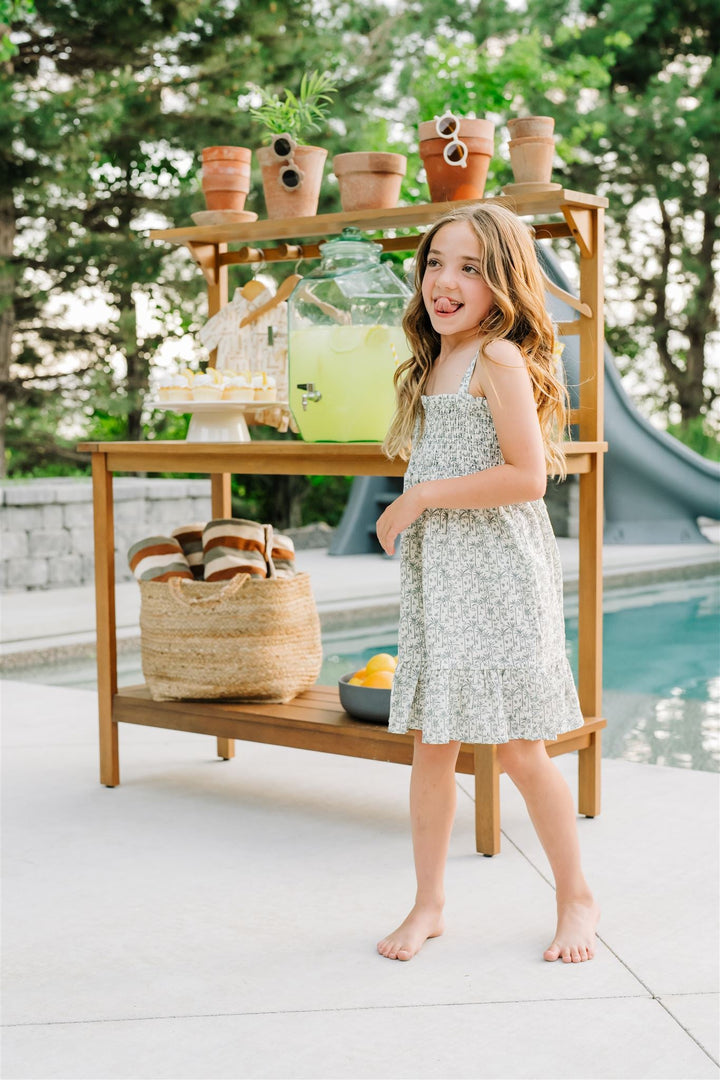 Soft texture close up of the Palm Tree Linen Dress, a gentle resort wear dress for babies