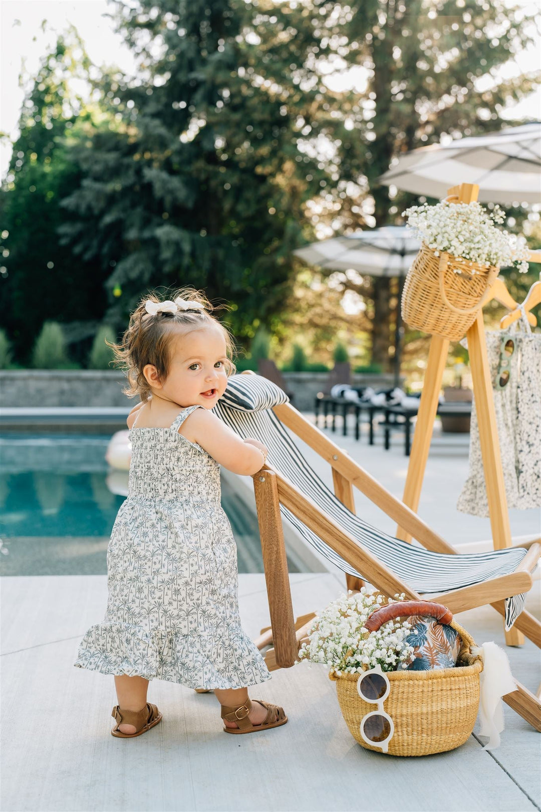 Mebie Baby Palm Tree Linen Dress pictured alongside coordinating baby accessories