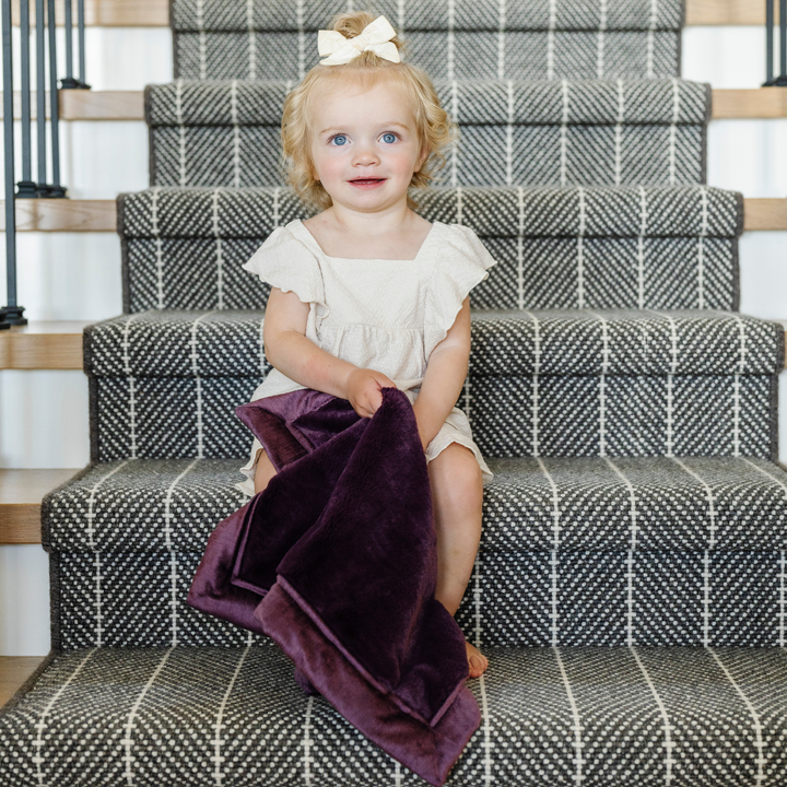 The Saranoni Lush Mini Blanket in Aubergine brings rich plush comfort well suited for baby boy blankets.