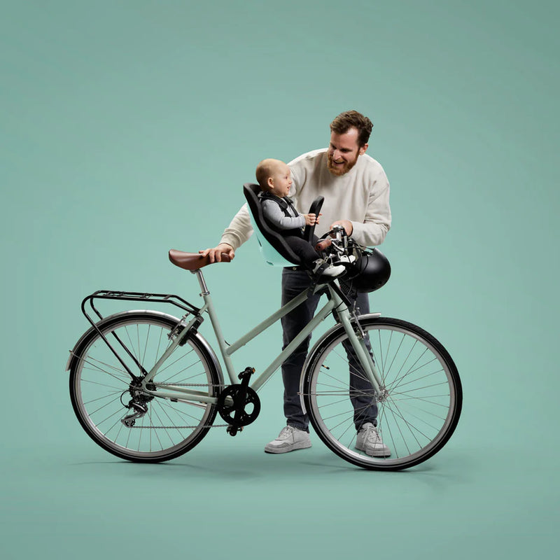 Mint Green Thule Yepp Nexxt2 Mini, an ergonomic and stylish children’s bike seat.