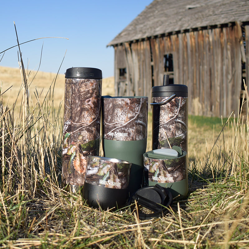 Barn background with Klean Kanteen 12oz TKWide Mossy Oak, leak proof twist cap and natural materials design.