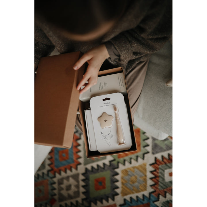 Assorted Mushie Star Toothbrush A set of colorful Mushie star toothbrushes perfect for making brushing fun for toddlers