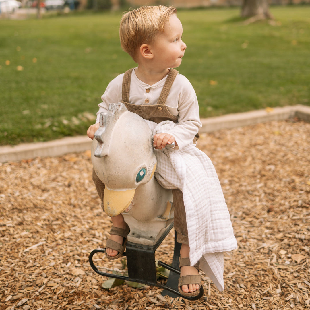 Beautiful Little Unicorn Cotton Muslin Baby Quilt - Tan Gingham offering four layers of softness, a premium muslin blankets baby essential.