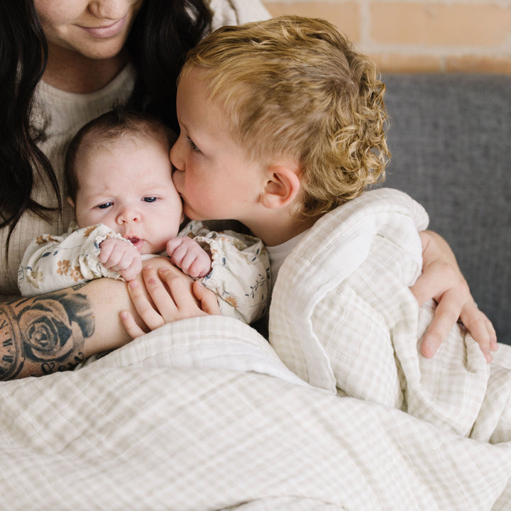 Textured Little Unicorn Cotton Muslin Quilted Throw - Tan Gingham, stylish muslin blanket for infants and toddlers.
