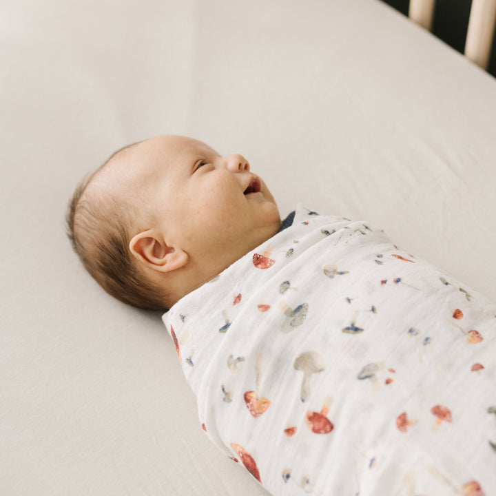Muslin for swaddling by Little Unicorn, Mushrooms pattern, soft and lightweight for infants.